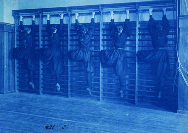 Circa 1899 cyanotype photo of high school girls climbing apparatus, Frances Benjamin Johnston